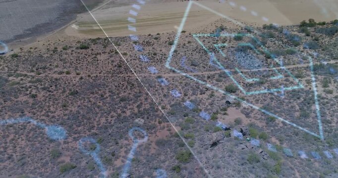Arid terrain revealing blue HUD while camera panning for mapping, hexagons rotating over cluster