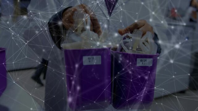 Tech reaching into purple caddy, sorting bulbs and transporting them left while mesh appearing