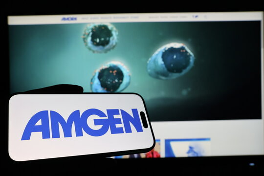 Kiel, Germany - 03-12-2026: Smartphone displaying US biotechnology company Amgen logo in front of companys webpage