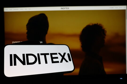 Kiel, Germany - 03-12-2026: Smartphone displaying Spanish fashion retail company Inditex logo in front of companys webpage