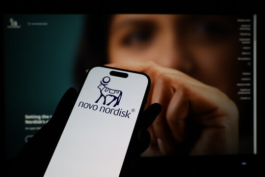 Kiel, Germany - 03-12-2026: Smartphone displaying Danish pharmaceuticals company Novo Nordisk logo in front of companys webpage