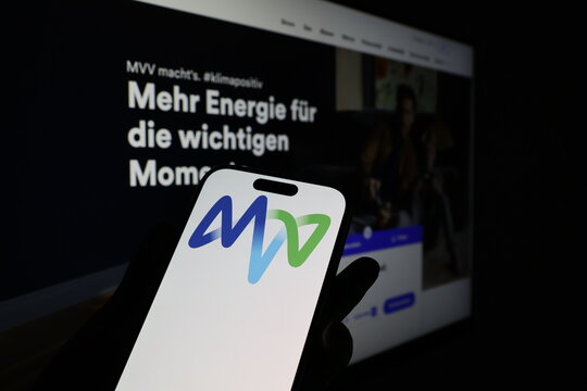 Kiel, Germany - 03-12-2026: Smartphone displaying German utility company MVV Energie logo in front of companys webpage