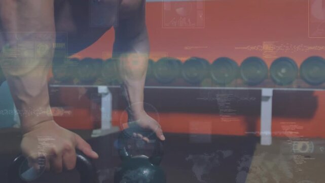 Leaning shirtless man securing two kettlebells on gym floor, with weight rack and HUD overlays