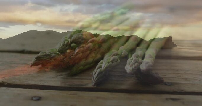 Asparagus bundle on deck coast, frame shift causing color streaks sweeping spears for food ads