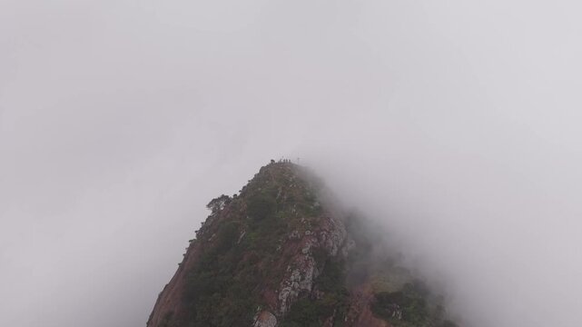 Aerial View of Tourists Standing on Kondarangi Hills Peak in Misty Clouds Tamil Nadu