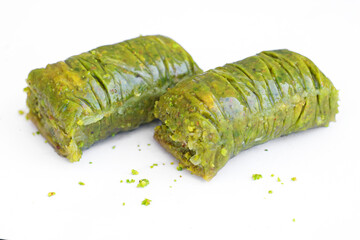 close up baklava with pistachio on white background