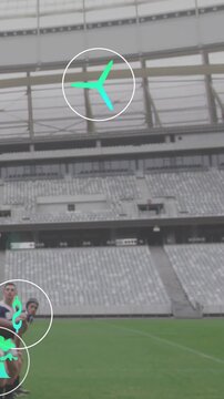 Lifting striped-jersey team forming lineout near sideline, with teal AR icons, stands, copy space
