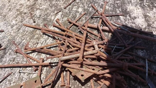 footage of many old rusty nails showing corrosion and decay caused by the oxidation process. 