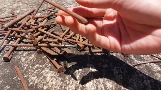 footage of many old rusty nails showing corrosion and decay caused by the oxidation process. 