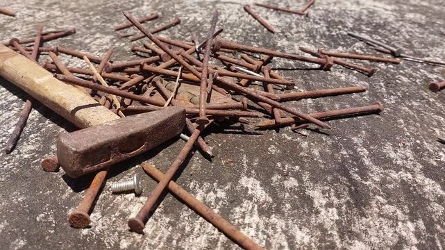 footage of many old rusty nails showing corrosion and decay caused by the oxidation process. 