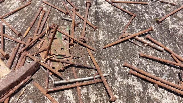 footage of many old rusty nails showing corrosion and decay caused by the oxidation process. 