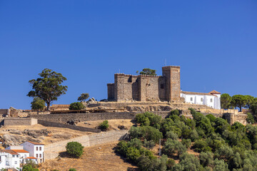Fototapeta premium Cortegana castle and church on hill in Huelva, Spain