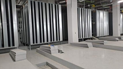 Industrial generator room with large exhaust silencers before generator installation