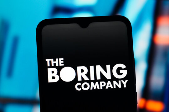 In this photo illustration, the Boring Company logo is seen displayed on a smartphone screen.