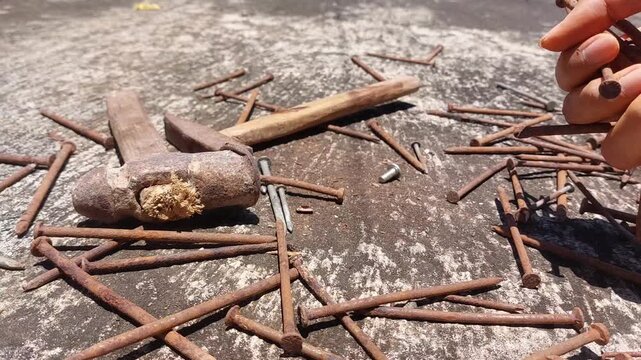 footage of many old rusty nails showing corrosion and decay caused by the oxidation process. 