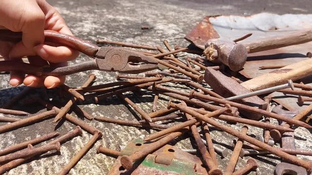footage of many old rusty nails showing corrosion and decay caused by the oxidation process. 