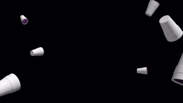White Paper Cups Falling and Rotating in Zero Gravity Against Black Background.