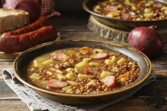 A bowl with traditional German Linsensuppe lentil soup in rustic style