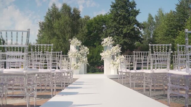 Refined garden ceremony with flowing floral arrangements. Sophisticated summer wedding in garden with airy decorations. Stylish outdoor event featuring floral decor for summer wedding celebration