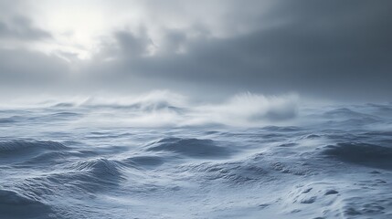 Obraz premium Dramatic winter landscape with snow covered terrain under a cloudy sky
