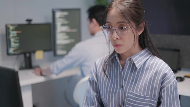 Programmer software engineer application server database developer coding working computer laptop indoor office, business information technology concept