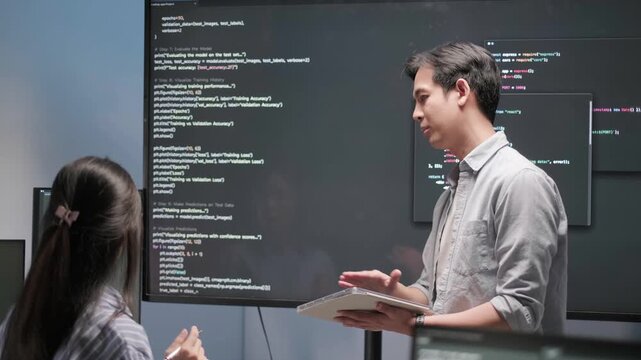 Programmer software developer engineer coding project presentation monitor meeting working data analysis business information technology tech support database concept