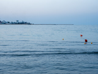 Calm Black Sea water with distant coastline at Saturn resort Romania © Dan Badiu