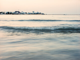Calm Black Sea water with distant coastline at Saturn resort Romania © Dan Badiu