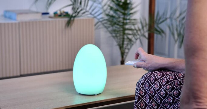 Illuminated Serenity: A soft, glowing, egg-shaped lamp casts a tranquil light on a minimalist desk scene, enhancing a sense of peace and relaxation.