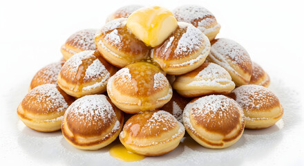 Fototapeta premium Fluffy mini Dutch pancakes with butter and powdered sugar, isolated on a plain white background
