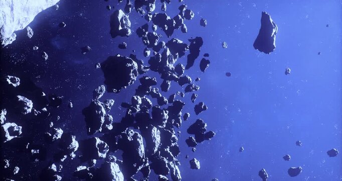 A cluster of asteroids is observed floating freely in the expanse of space, illuminated by distant stars. The dark backdrop enhances the rugged surfaces and various sizes of the asteroids.