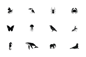 Fototapeta premium Black silhouettes of diverse animals including insects birds and marine life