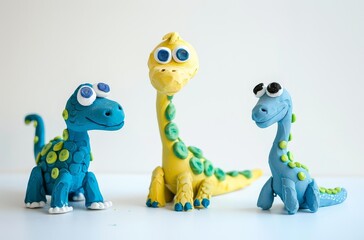 Fototapeta premium Cute clay dinosaurs trio colorful playdough dinosaur characters isolated on white background playful kids design