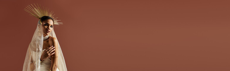 Captivating young woman radiates elegance in a stunning white dress and bridal veil