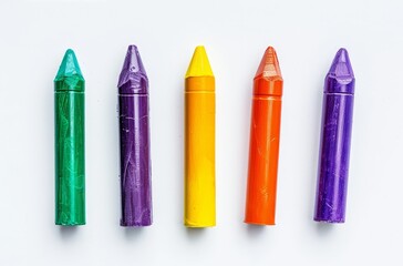 Six colorful crayon cylinders arranged in flat lay top view isolated on white background creative drawing supplies concept