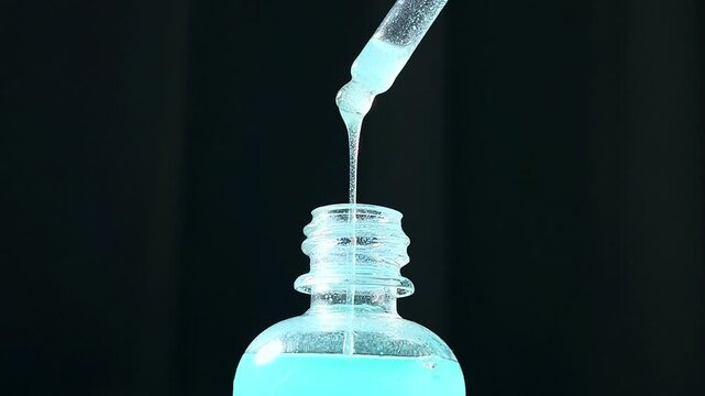 Close up of Blue Copper Peptides GHK-Cu in Pipette. Beauty serum for anti aging beauty routine