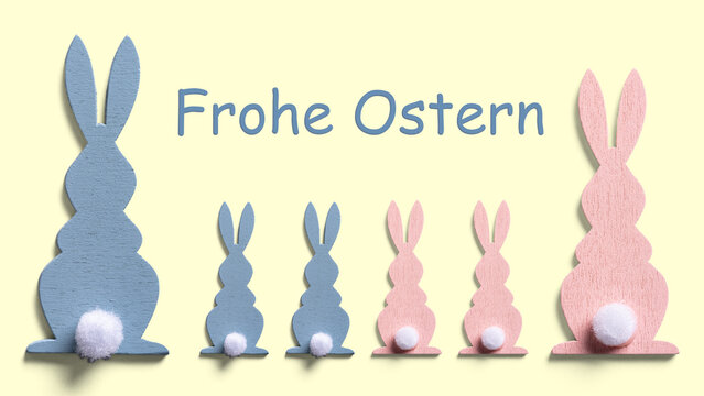 R&uuml;ckansicht von einer Familie von Osterhasen in rosa und hellblau w&uuml;nschen frohe Ostern