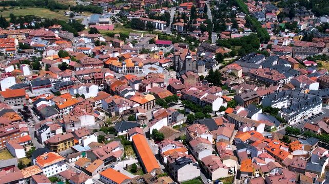 Aerial panorama view around the downtown of the city El Espinar  in Spain on a sunny summer noon.