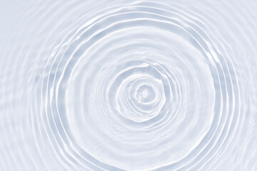 Fototapeta premium White water with ripples on the surface. Defocus blurred transparent white colored clear calm water surface texture with splashes and bubbles. Water waves with shining pattern texture background.