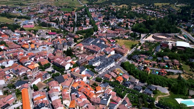 Aerial panorama view around the downtown of the city El Espinar  in Spain on a sunny summer noon.