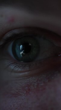 Vertical screen close up human eye with abstract interface reflection symbolizing observation of artificial intelligence development technological progress digital evolution and focused attention on A