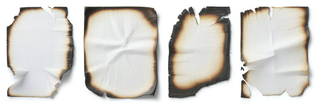 Burned paper pieces on white background