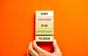 Challenge word symbol. Concept words Every challenge is an opportunity to grow on beautiful wooden blocks. Beautiful orange paper background. Business challenge is an opportunity concept. Copy space.