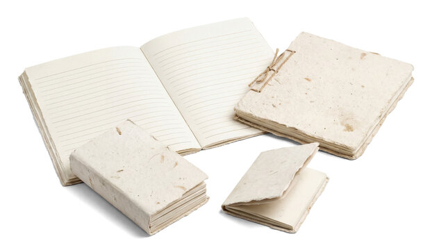 a collection of handmade paper notebooks and journals, showcasing various sizes and textures for writing and creativity.