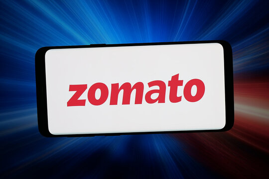 Stuttgart, Germany - 03-09-2026: In this photo illustration, the logo of Indian food delivery company Zomato is displayed on a smartphone in front of abstract background on computer screen.