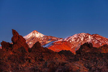 Mount Teide Volcano at Sunset Above Red Lava Landscape in Teide National Park, Tenerife © Victoria Schaad