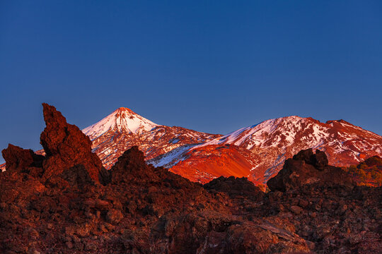Mount Teide Volcano at Sunset Above Red Lava Landscape in Teide National Park, Tenerife