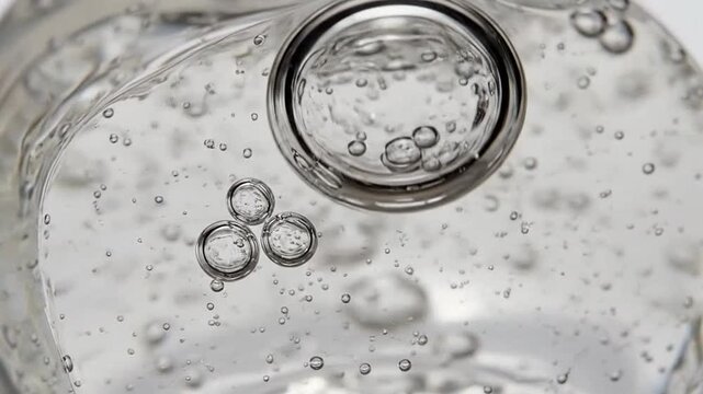 Close-up of clear liquid with bubbles.