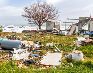 ruins and distructions cousea by a devastating typhoon on a sea coast. elimination of the damage and distructions caused by the hurricane to the coast © Yaroslav