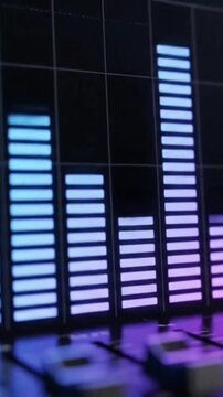 Glowing blue and purple sound level meter bars on a music mixer board